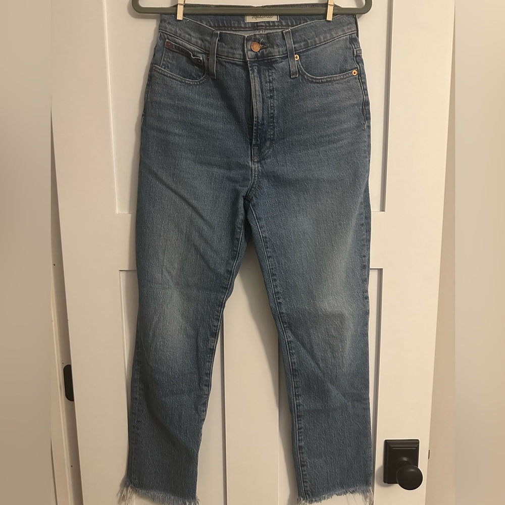 Madewell. The perfect vintage jean, medium wash with fading, raw hem. Size 28